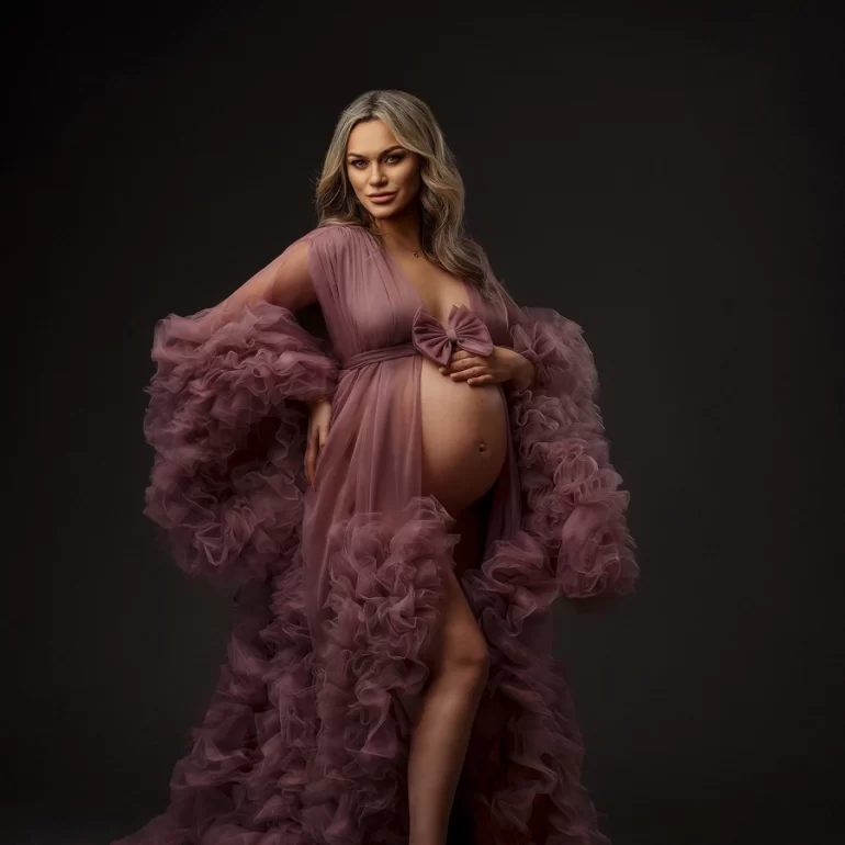 Mauve ruffled gown with front bow; barefoot, calm confidence.