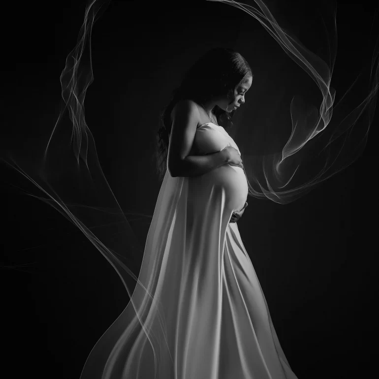 B&W silky drape; delicate wisps circle serene profile.