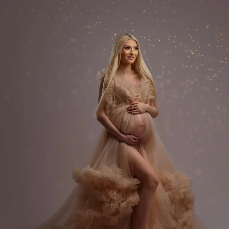 Beige ruffled gown with golden light halo; warm, elegant portrait.