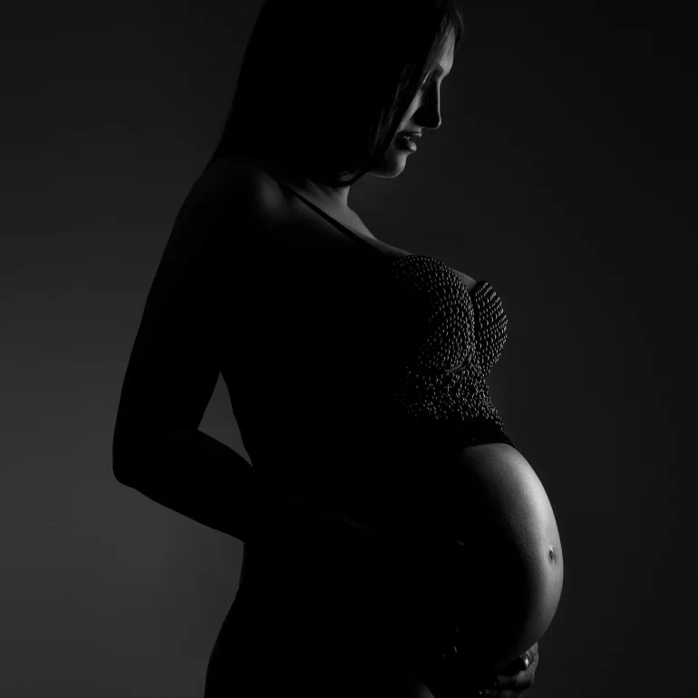 B&W profile; soft light emphasizes the curve; textured top.