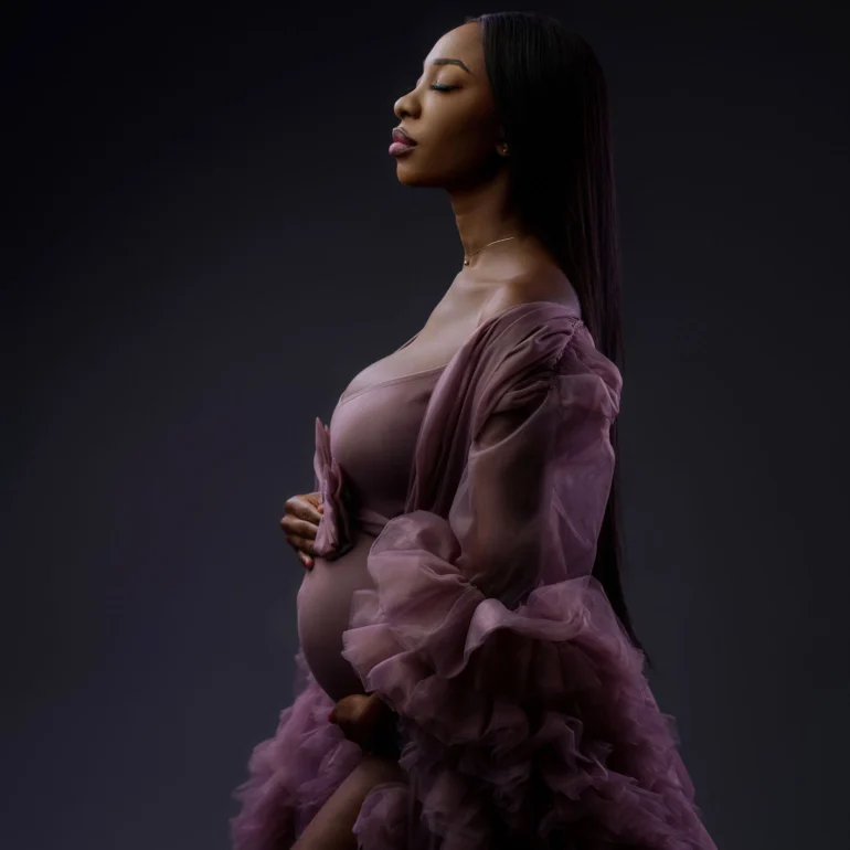 Soft mauve gown with layered tulle; graceful profile; subtle light.